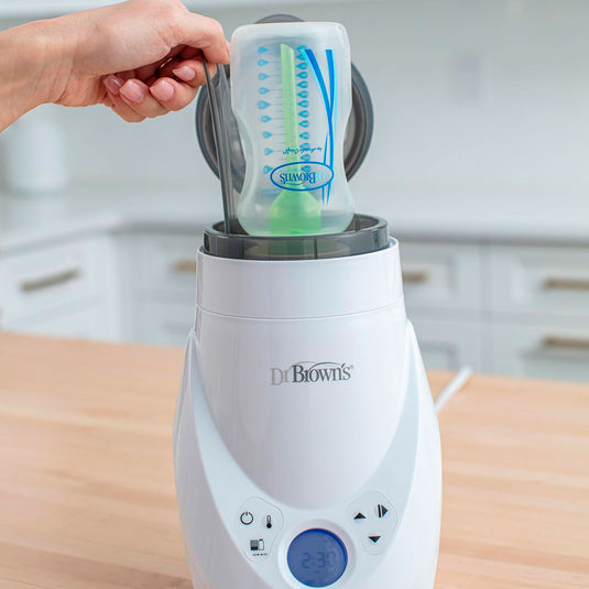 Calentador y esterilizador a vapor Deluxe de teteros, calentador rápido y uniforme de biberones, con panel LCD, fácil de usar, alertas de sonido cuando completa ciclo, funcionalidad 2en1 - Dr Brown's