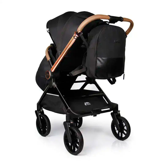 Coche paseador reversible para bebé, con respaldo ajustable, toldo en varias secciones adaptable, sistema de plegado compacto e incluye pañalera - Kidilo