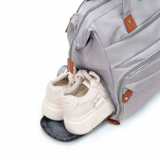 Pañalera bolso de mamá de gran capacidad, con panel tejido, cambiador, portachupos y correa de hombro.