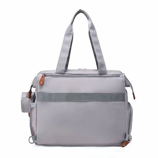 Pañalera bolso de mamá de gran capacidad, con panel tejido, cambiador, portachupos y correa de hombro.