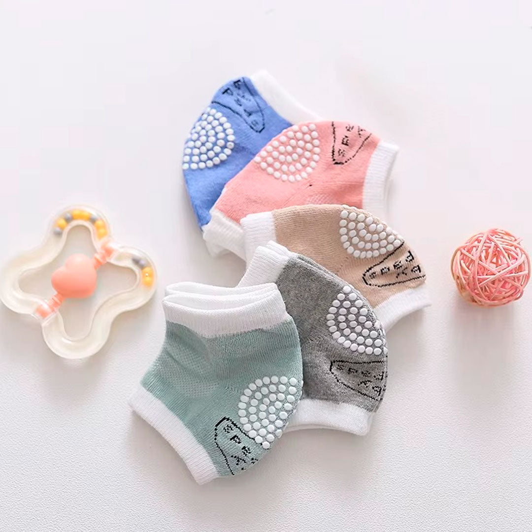 Rodilleras de algodón antideslizantes para el gateo del bebé, hechas en material hipoalergénico, ajustables, protegen contra el frio del suelo, en colores llamativos