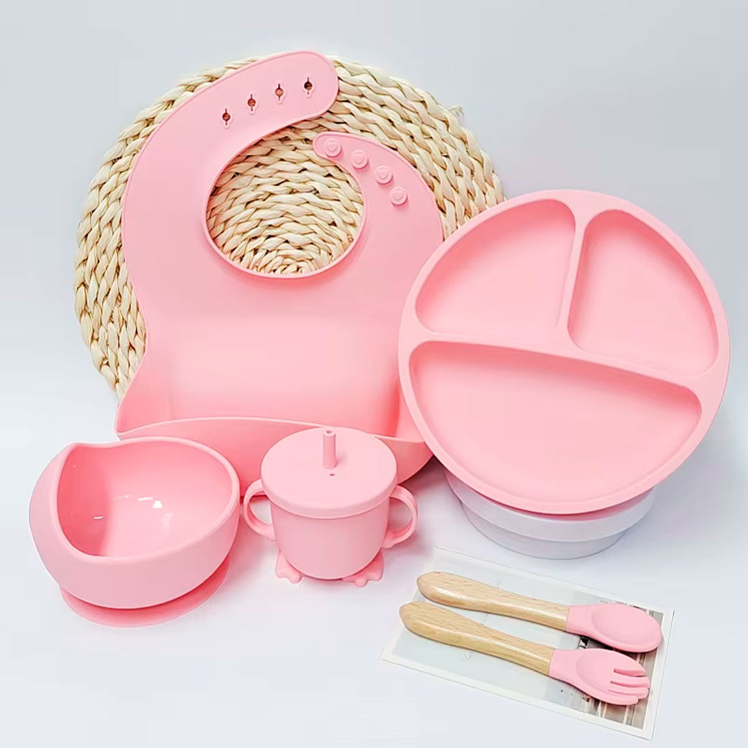 Vajilla 7pz en silicona grado alimenticio, 100% libre de BPA, cubiertos de silicona suave con mango en madera, adhesión a superficie plana, con babero recolector