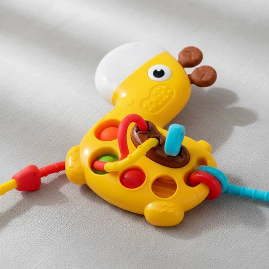 Juguete sensorial jirafa Montessori con mordedor, anillos y texturas para bebé
