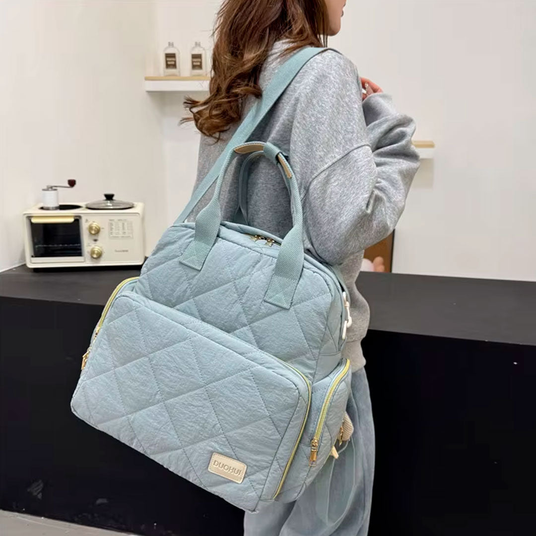 Bolso pañalera Duohui de múltiples compartimientos, con correa para uso lateral, de buena capacidad de almacenamiento, morral en tela resistente e impermeable para pañales