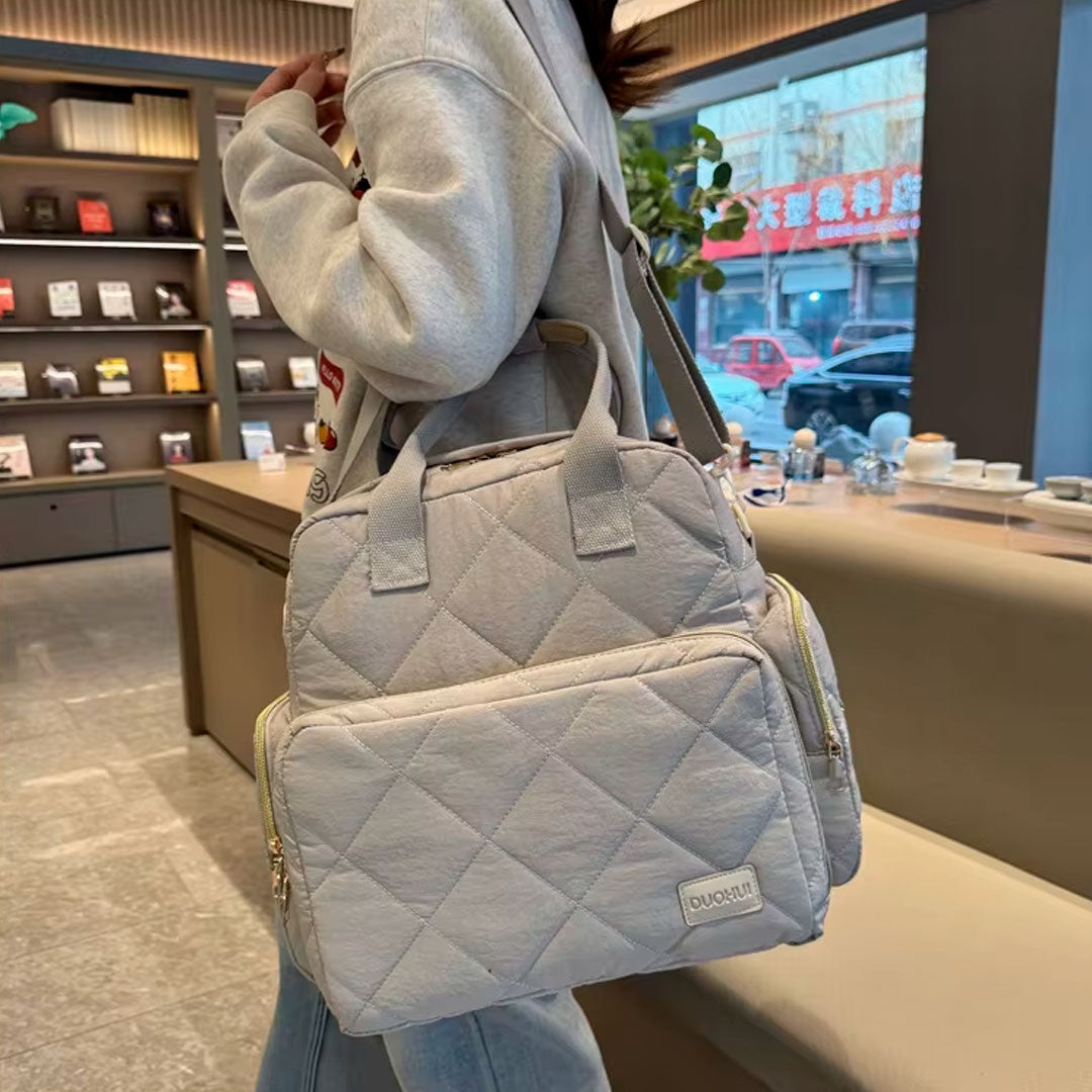 Bolso pañalera Duohui de múltiples compartimientos, con correa para uso lateral, de buena capacidad de almacenamiento, morral en tela resistente e impermeable para pañales