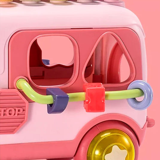 Bus xilófono didáctico multiactividades, con piezas para encaje de diferentes formas y colores, con ruedas sonajeros, hecho en material resistente