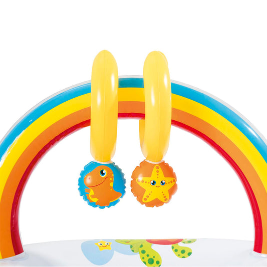Cambiador inflable arcoíris, diseño colorido y divertido con móviles colgantes