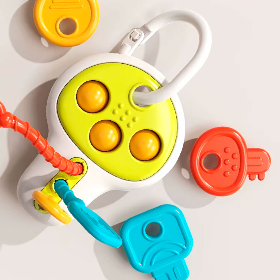 Llave educatica multifuncional para bebé, diseño y colores llamativos, juegos de cuerda, giros y sonidos que incentivan la exploración del juguete en tu bebé
