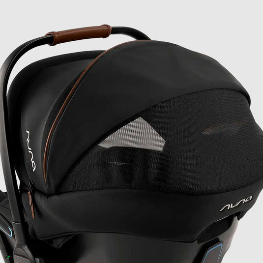 Coche paseador con portabebés "Triv Next", con espaldar reclinable, arnés de seguridad de 5 puntos, barra de empuje ajustable y detalles en cuero sintético - Nuna