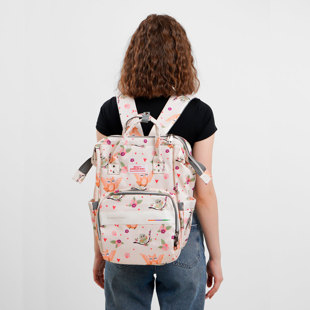 Pañalera Estampada tipo morral con bolsillos térmicos y bolsillo trasero