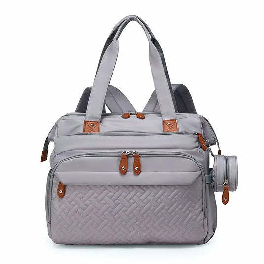 Pañalera bolso de mamá de gran capacidad, con panel tejido, cambiador, portachupos y correa de hombro.