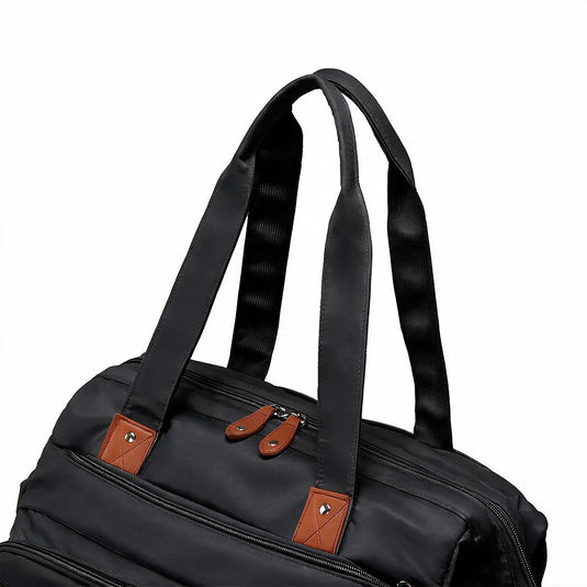 Pañalera bolso de mamá de gran capacidad, con panel tejido, cambiador, portachupos y correa de hombro.