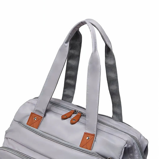 Pañalera bolso de mamá de gran capacidad, con panel tejido, cambiador, portachupos y correa de hombro.
