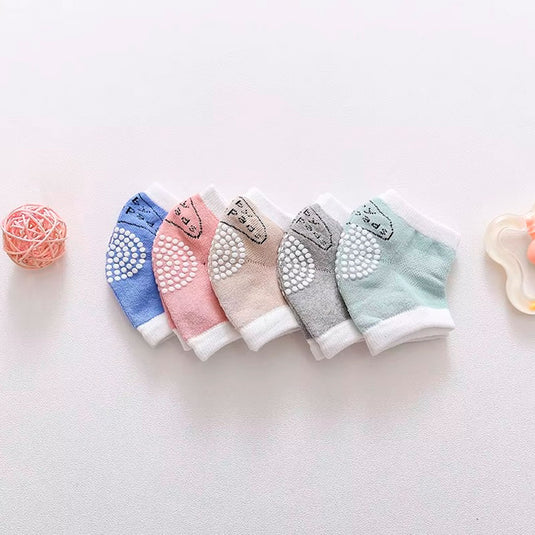 Rodilleras de algodón antideslizantes para el gateo del bebé, hechas en material hipoalergénico, ajustables, protegen contra el frio del suelo, en colores llamativos